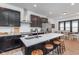 Modern kitchen with black cabinets, white countertops, and stainless steel appliances at 3550 N Illinois St, Indianapolis, IN 46208