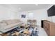 Spacious living room boasts modern decor, large rug, comfortable sofa, and stylish chairs for relaxing and entertaining at 3550 N Illinois St, Indianapolis, IN 46208