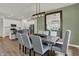Dining room with wood table, seating for six, view into the kitchen with stainless appliances at 3706 Cantebury Dr, Franklin, IN 46131