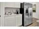 Bright kitchen featuring stainless steel refrigerator, white cabinets, and a dedicated coffee station at 3706 Cantebury Dr, Franklin, IN 46131