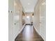 Inviting hallway with hardwood floors, white doors, and stylish decor at 3745 Cantebury Dr, Franklin, IN 46131