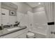 Clean bathroom with white subway tile, a shower-tub combo, and modern fixtures offering a pristine space at 3870 Flora Dr, Franklin, IN 46131