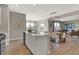 Open-concept kitchen with an island overlooking the dining area and the welcoming living room at 3870 Flora Dr, Franklin, IN 46131