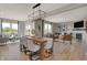 Open-concept living space with a dining area seamlessly connecting to a comfortable living room featuring a fireplace at 3870 Flora Dr, Franklin, IN 46131
