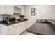 Finished bar area with modern stainless steel appliances and plenty of storage at 4243 Riverbirch Run, Zionsville, IN 46077