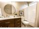 Bathroom featuring a vanity with updated fixtures, a tiled shower/tub, and decorative accents at 4243 Riverbirch Run, Zionsville, IN 46077