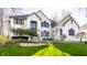 Charming two-story home with white brick and a well-maintained lawn, enhancing its curb appeal at 4243 Riverbirch Run, Zionsville, IN 46077