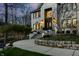 Inviting front porch with stone steps and manicured landscaping, creating a welcoming entrance at 4243 Riverbirch Run, Zionsville, IN 46077
