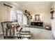Comfortable living room features large windows, stylish furniture, and neutral decor at 4243 Riverbirch Run, Zionsville, IN 46077