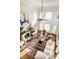 Spacious living room with high ceilings, large windows, fireplace, and elegant decor at 4243 Riverbirch Run, Zionsville, IN 46077