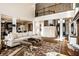 Open living room showcases high ceilings, a second-story landing, and an adjacent dining area at 4243 Riverbirch Run, Zionsville, IN 46077