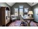 Cozy office with a vaulted ceiling, natural light, and a built-in cabinet for storage at 4243 Riverbirch Run, Zionsville, IN 46077