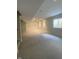 Spacious basement with neutral carpet, recessed lighting, and bright window at 5421 Upper Garden Way, Zionsville, IN 46077