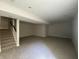 Finished basement features neutral carpet, recessed lighting and convenient staircase at 5421 Upper Garden Way, Zionsville, IN 46077