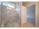 Beautiful walk-in shower with marble-like tiling and glass door at 5421 Upper Garden Way, Zionsville, IN 46077