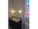 Bathroom featuring granite countertops, a rectangle mirror, and modern globe lights at 5421 Upper Garden Way, Zionsville, IN 46077