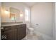 Bathroom with custom vanity, mirror, light fixture and checkered tiling at 5421 Upper Garden Way, Zionsville, IN 46077