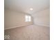 Spacious bedroom with plush carpeting and natural light from the window at 5421 Upper Garden Way, Zionsville, IN 46077