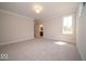 Spacious bedroom with neutral carpet, great natural light, and bathroom access at 5421 Upper Garden Way, Zionsville, IN 46077