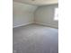 Large carpeted bedroom with ample natural light from the window at 5421 Upper Garden Way, Zionsville, IN 46077