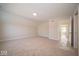 A spacious bedroom with plush carpeting and a clear view to other rooms at 5421 Upper Garden Way, Zionsville, IN 46077