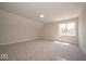 Large bedroom with lush carpeting and plenty of natural light at 5421 Upper Garden Way, Zionsville, IN 46077