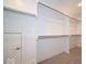 Walk-in closet with clothing racks and overhead shelving at 5421 Upper Garden Way, Zionsville, IN 46077