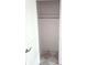 Walk-in closet features a metal clothes rod and neutral tile flooring at 5421 Upper Garden Way, Zionsville, IN 46077