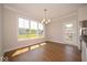Bright dining room with large windows and hardwood floors at 5421 Upper Garden Way, Zionsville, IN 46077