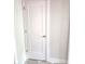 Modern white painted paneled door with a silver door knob and matching trim at 5421 Upper Garden Way, Zionsville, IN 46077