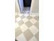 Neutral tile flooring laid in a diamond pattern adds a modern touch to the interior design at 5421 Upper Garden Way, Zionsville, IN 46077