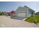 Detached two-car garage with a gravel driveway, set in a neighborhood with well-kept yards at 5421 Upper Garden Way, Zionsville, IN 46077