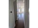 Inviting hallway with hardwood floors leading to a bright, open living space with plenty of natural light at 5421 Upper Garden Way, Zionsville, IN 46077