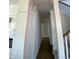 Hallway leading to the stairs showcasing the home's layout and design at 5421 Upper Garden Way, Zionsville, IN 46077