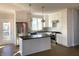Bright kitchen with stainless steel appliances, white cabinets, and island at 5421 Upper Garden Way, Zionsville, IN 46077