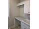 Laundry area featuring built-in cabinets and countertops and a neutral paint at 5421 Upper Garden Way, Zionsville, IN 46077