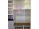 Mud room with a built-in bench with hooks, cabinets and storage area at 5421 Upper Garden Way, Zionsville, IN 46077