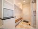 Mudroom features built-in shelves, cabinets, coat hooks, and bench at 5421 Upper Garden Way, Zionsville, IN 46077