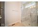 Glass shower stall with white tile and a built-in bench at 5421 Upper Garden Way, Zionsville, IN 46077