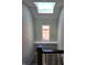 Top of staircase showing window, skylight, and built-in shelves at 5421 Upper Garden Way, Zionsville, IN 46077