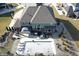 Aerial view of a backyard with a pool, hot tub, patio, and a landscaped pond at 5683 Oakmont Blvd, Bargersville, IN 46106