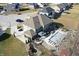 Aerial view of the home with a basketball hoop, water feature, and covered pool in a well-maintained backyard at 5683 Oakmont Blvd, Bargersville, IN 46106