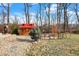 Backyard with a playhouse, garden area, and stone landscaping; great for outdoor activities at 5683 Oakmont Blvd, Bargersville, IN 46106