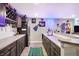 Basement wet bar featuring a sports-themed rug, stainless steel fridge, and marble countertops at 5683 Oakmont Blvd, Bargersville, IN 46106