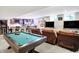 Finished basement boasting a pool table, TV area, and bar with stool seating at 5683 Oakmont Blvd, Bargersville, IN 46106