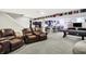 Basement boasting a seating area with recliners, a pool table, and a bar with stool seating at 5683 Oakmont Blvd, Bargersville, IN 46106