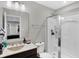 Clean bathroom featuring a shower with glass door, vanity with sink, and ample lighting at 5683 Oakmont Blvd, Bargersville, IN 46106