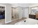 Modern bathroom featuring a glass-enclosed shower with decorative tile, a soaking tub, and dual sink vanity at 5683 Oakmont Blvd, Bargersville, IN 46106