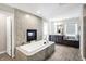 Bathroom featuring a large soaking tub, fireplace and vanity area at 5683 Oakmont Blvd, Bargersville, IN 46106