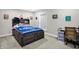 Cozy bedroom with a full bed, a workspace, and carpeted floors at 5683 Oakmont Blvd, Bargersville, IN 46106